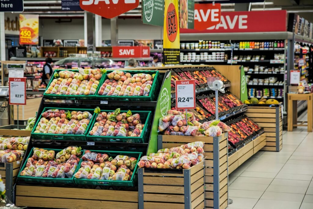 pexels-photo-264636-264636 Colorful produce aisle in a supermarket showcasing fresh apples with discount signage.